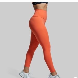 Born Primitive “your go to leggings 2.0” orange size M. NWT.